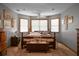 Bedroom with gray walls, carpet and trim, bay windows and dark wood furniture at 427 Grape Arbor Drive Dr, Summerville, SC 29486