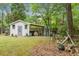 Backyard with a outbuilding featuring an adjacent covered area for outdoor projects and storage at 427 Grape Arbor Drive Dr, Summerville, SC 29486