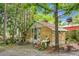 Rustic outbuilding with a charming design, surrounded by trees and greenery, offering a peaceful retreat at 427 Grape Arbor Drive Dr, Summerville, SC 29486