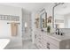 Elegant bathroom with double sinks, quartz countertops, decorative accents, and modern fixtures at 428 Bluegill Ln, Johns Island, SC 29455
