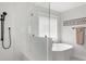 Luxurious bathroom features a glass-enclosed shower, soaking tub, and modern fixtures at 428 Bluegill Ln, Johns Island, SC 29455