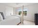 Cozy bedroom with a four poster bed, water view, and lots of natural light at 428 Bluegill Ln, Johns Island, SC 29455