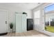 Bright mudroom with wooden floors, a storage cabinet, and an exterior access door at 428 Bluegill Ln, Johns Island, SC 29455