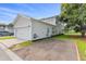 Side exterior shows a white two-story house with a two-car garage and small garden at 428 Bluegill Ln, Johns Island, SC 29455