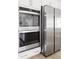 Close up of stainless steel oven and refrigerator in a modern white kitchen at 428 Bluegill Ln, Johns Island, SC 29455