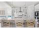 Modern kitchen with white cabinets, an island with seating, and stainless steel appliances at 428 Bluegill Ln, Johns Island, SC 29455
