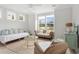 Bright living room features natural light, hardwood floors, and comfortable seating area at 428 Bluegill Ln, Johns Island, SC 29455