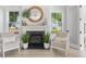 Cozy living room with fireplace and comfortable seating with lots of natural light at 428 Bluegill Ln, Johns Island, SC 29455