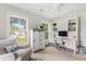 Bright office space with white cabinetry, natural light, and a comfortable seating area at 428 Bluegill Ln, Johns Island, SC 29455