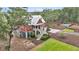 Aerial view of a two-story house with a backyard pool surrounded by lush greenery at 4352 Park Island Rd, Hollywood, SC 29449