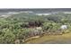 An aerial view of a charming home nestled in lush greenery and surrounded by tranquil waters at 4352 Park Island Rd, Hollywood, SC 29449