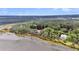 Aerial view showcasing the home's waterfront location and its proximity to lush greenery and marshland at 4352 Park Island Rd, Hollywood, SC 29449