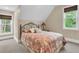Cozy bedroom featuring natural light from two windows and a patterned bedspread at 4352 Park Island Rd, Hollywood, SC 29449