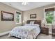Comfortable bedroom with neutral walls, a queen-size bed, two windows, and ceiling fan for a relaxed ambiance at 4352 Park Island Rd, Hollywood, SC 29449