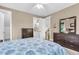 Comfortable bedroom with neutral walls, warm furniture and a connected door to another room at 4352 Park Island Rd, Hollywood, SC 29449
