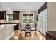 Eat-in kitchen dining area with dark wood table set and natural light at 4352 Park Island Rd, Hollywood, SC 29449