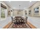 Classic dining room featuring a beautiful wood table and view of the outdoors through the window at 4352 Park Island Rd, Hollywood, SC 29449