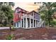 Lovely two-story home featuring a screened porch, deck, and a three-car garage, surrounded by trees at 4352 Park Island Rd, Hollywood, SC 29449