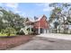 Charming two-story home with manicured lawn, garage, and staircase at 4352 Park Island Rd, Hollywood, SC 29449
