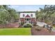 Charming home with a manicured front lawn and a classic staircase leading to the front door at 4352 Park Island Rd, Hollywood, SC 29449