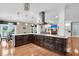 Large gourmet kitchen featuring marble countertops and sleek cabinetry that opens to a cozy living space at 4352 Park Island Rd, Hollywood, SC 29449