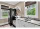 A functional laundry room with granite countertops, cabinetry and a modern washer and dryer set at 4352 Park Island Rd, Hollywood, SC 29449