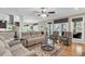 Spacious living room with hardwood floors, neutral decor, and views into the dining area and beyond at 4352 Park Island Rd, Hollywood, SC 29449