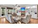 Bright living room featuring a fireplace, built-in shelving, and hardwood floors at 4352 Park Island Rd, Hollywood, SC 29449