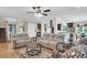 Open-concept living room showcasing hardwood floors, comfortable seating, and an inviting atmosphere at 4352 Park Island Rd, Hollywood, SC 29449