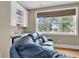 Living room with hardwood floors, a blue couch, and natural light from the window at 4352 Park Island Rd, Hollywood, SC 29449