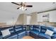 Open living area with hardwood floors, blue sofa, bar area, and lofted ceilings at 4352 Park Island Rd, Hollywood, SC 29449