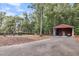 Property with outdoor pool and equipment storage in the building with a garage door at 4352 Park Island Rd, Hollywood, SC 29449