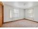 Bright bedroom featuring carpeted floors and lots of natural light from the two windows at 4822 Parker Dr, North Charleston, SC 29405