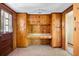 Versatile bonus room with knotty pine cabinets, counter space, and ample storage, perfect for a home office or craft room at 4822 Parker Dr, North Charleston, SC 29405