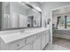 Bright bathroom with white countertops and a large framed mirror at 513 Sea Foam St, Summerville, SC 29486