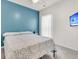 This bedroom features a calming blue accent wall, a comfortable bed, and a flatscreen TV for added convenience at 513 Sea Foam St, Summerville, SC 29486