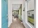 Inviting foyer showcasing wood floors and a glimpse into the brightly lit living room with green accents at 513 Sea Foam St, Summerville, SC 29486