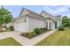A well-maintained home featuring an attached garage, tidy landscaping, and a welcoming front entrance at 513 Sea Foam St, Summerville, SC 29486