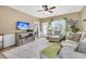 Cozy living room with plush rug, neutral tones, and entertainment center at 513 Sea Foam St, Summerville, SC 29486