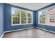 Cozy room with large windows providing a bright and airy atmosphere and wood-look flooring at 60 Fenwick Hall Allee # 738, Johns Island, SC 29455