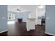 Inviting living space featuring a fireplace, ceiling fan, wood floors and an open kitchen with stainless appliances at 60 Fenwick Hall Allee # 738, Johns Island, SC 29455
