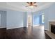 Expansive living room with ample natural light, ceiling fan, and a fireplace, perfect for entertaining guests at 60 Fenwick Hall Allee # 738, Johns Island, SC 29455