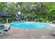 Inviting community pool with ample seating and serene wooded views at 60 Fenwick Hall Allee # 738, Johns Island, SC 29455