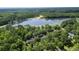 An aerial view of a property situated near a serene lake and lush woodlands at 617 Deepwood Ct, Moncks Corner, SC 29461