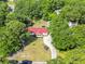 Aerial view highlighting a single-Gathering home surrounded by mature trees, a long driveway, and backyard at 617 Deepwood Ct, Moncks Corner, SC 29461