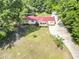 An aerial shot of a charming home featuring a red roof, well-kept lawn, and convenient driveway at 617 Deepwood Ct, Moncks Corner, SC 29461