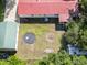 Aerial shot of backyard featuring detached garage, trampoline, lawn mower, and other recreational items at 617 Deepwood Ct, Moncks Corner, SC 29461