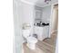 This cozy bathroom offers wood-look floors and a quaint white vanity at 617 Deepwood Ct, Moncks Corner, SC 29461