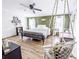 Comfortable bedroom with ceiling fan, and natural light from the dual windows at 617 Deepwood Ct, Moncks Corner, SC 29461