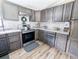 Well-appointed kitchen with grey cabinetry, stone countertops, and stainless steel oven at 617 Deepwood Ct, Moncks Corner, SC 29461